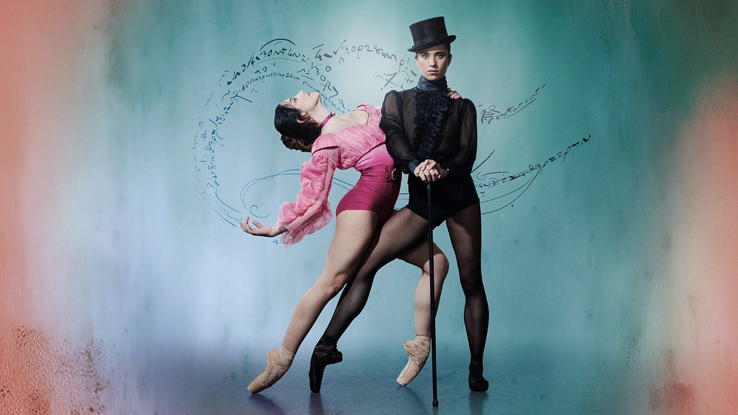 Wearing a black top hat and pointe shoes, the character of Gentleman Jack looks directly at the camera hands on a cane, a woman in pink hold onto her and leans back suggestively