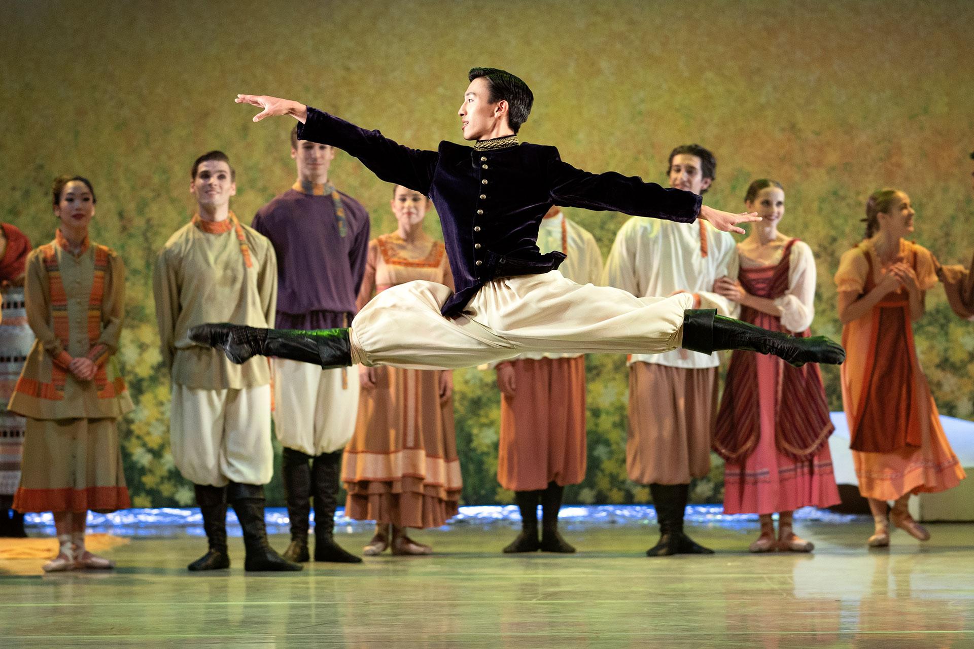 Northern Ballet dancer Matthew Koon as the young Prince leaping through the air as he entertains at the grand picnic. Photo Emma Kauldhar.
