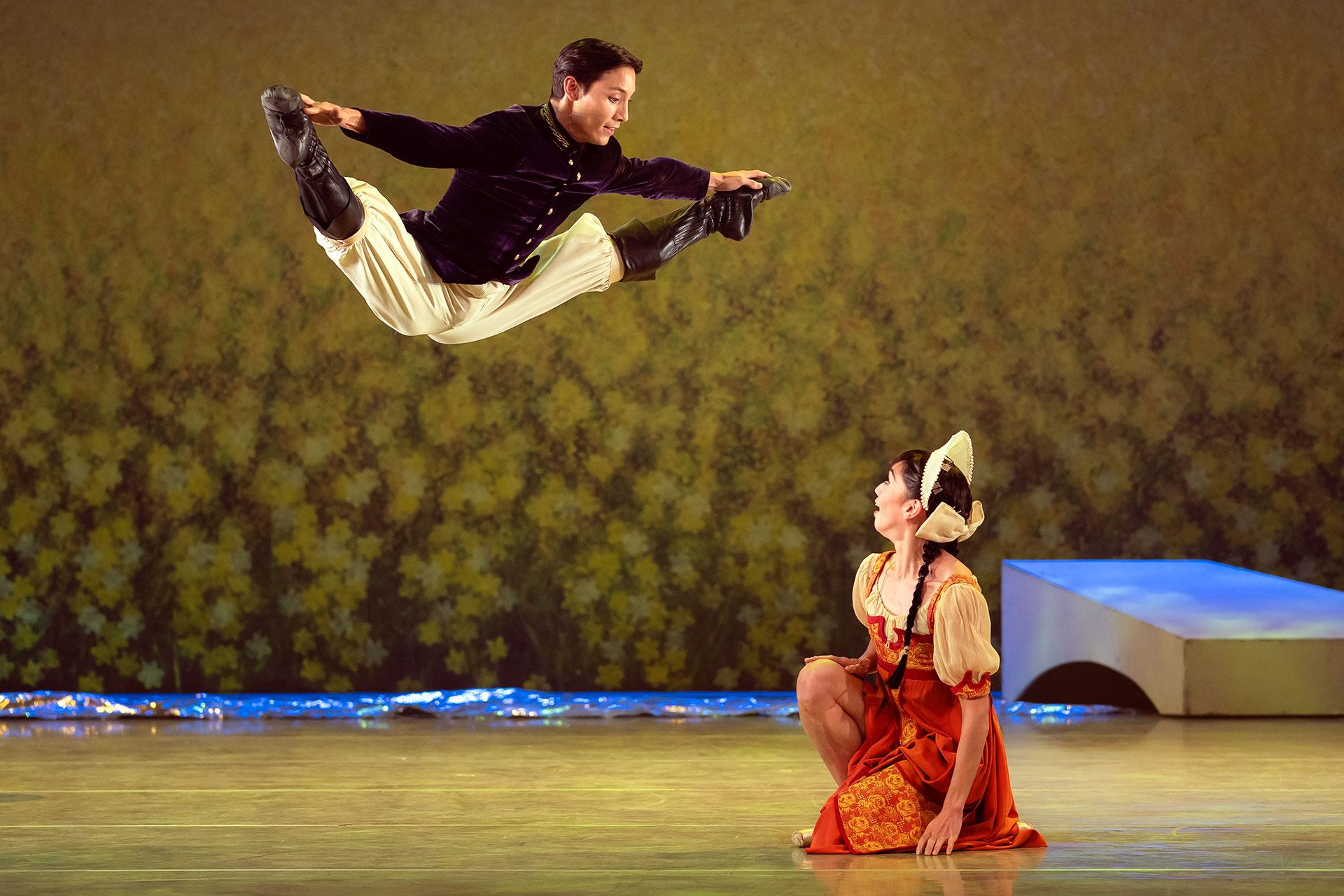 KEving Poeung as the young Prince jumps high in the air impressing the young Cinderella, performed by Rachael Gillespie. Photo Emma Kauldhar.