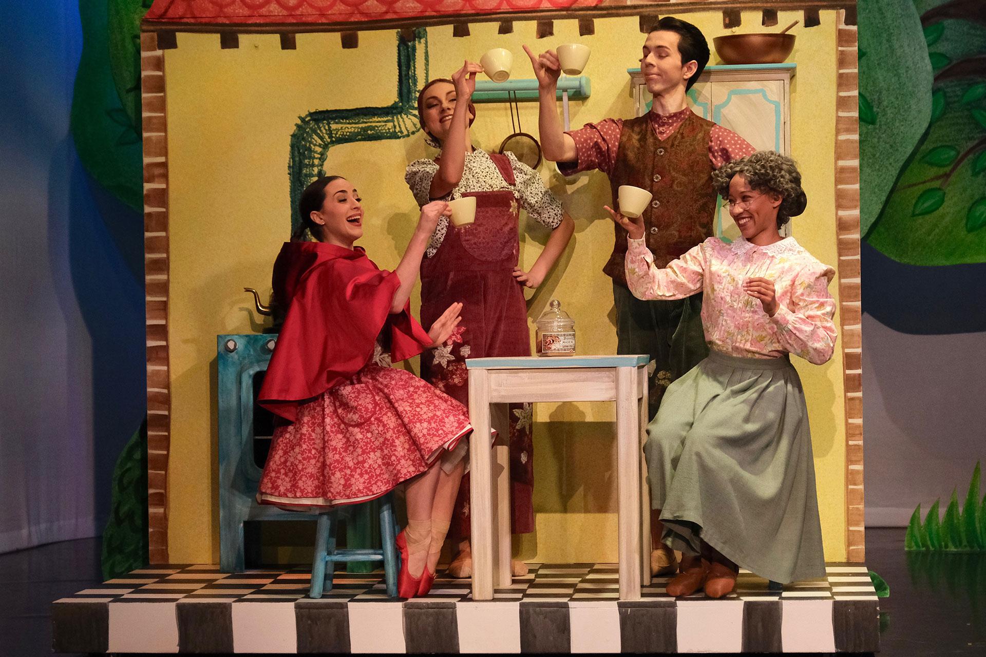 Little Red's family gather around the kitchen table to drink some tea