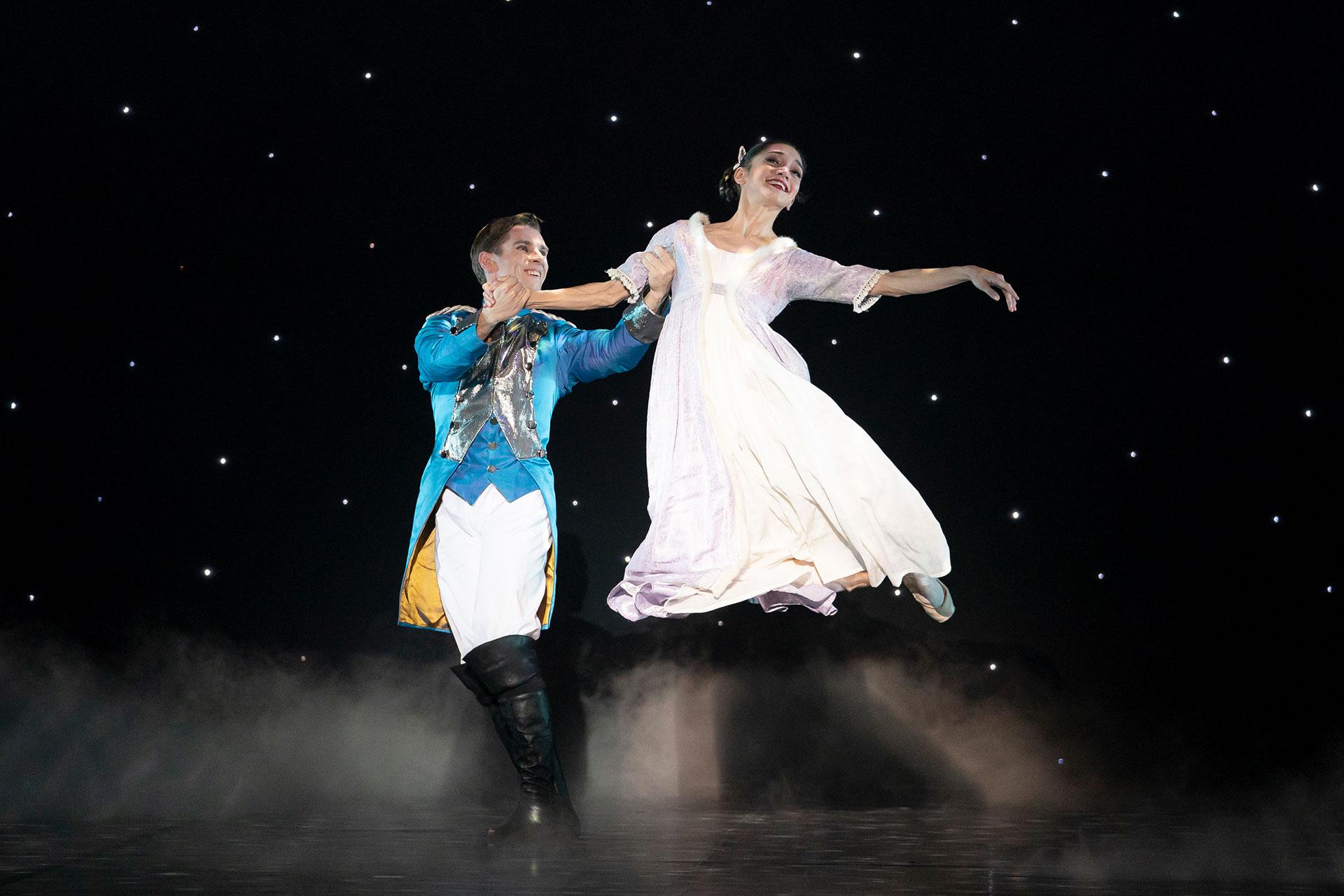 The Nutcracker Prince lifts Clara high on their way into the dreamland