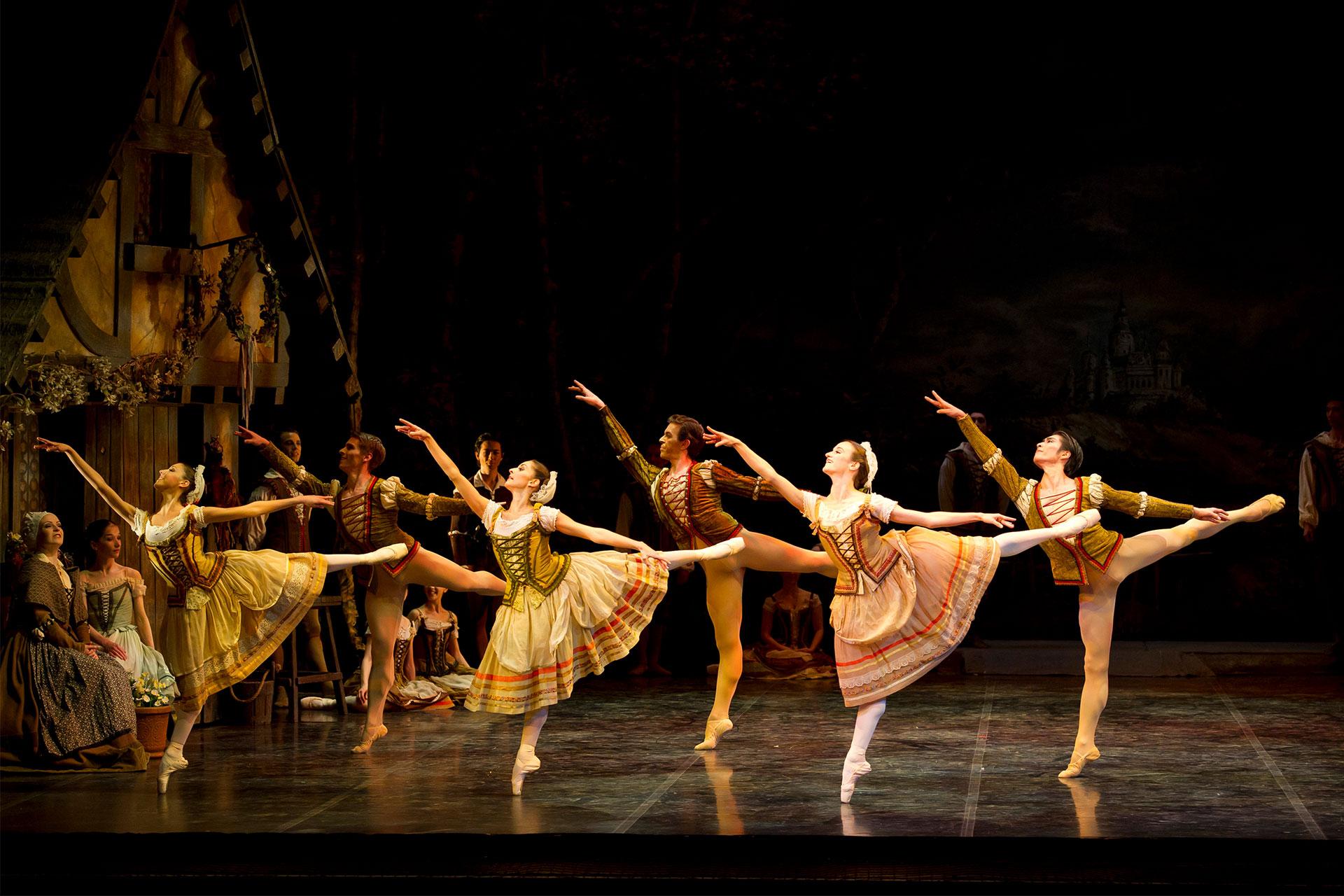 Dancers lined up in arabesque