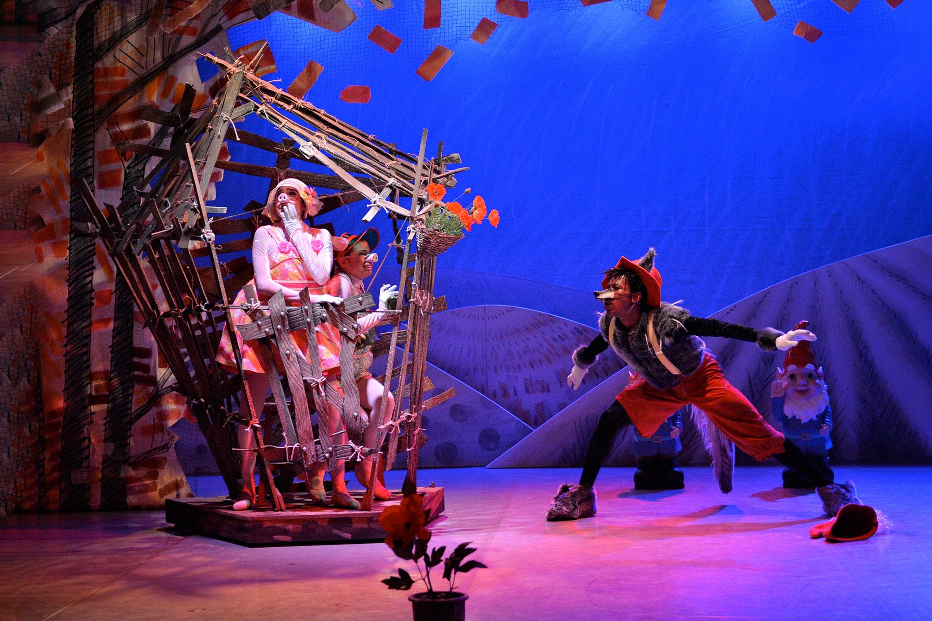 In the house made of sticks two pigs try and hide from Wolf huffing and puffing outside