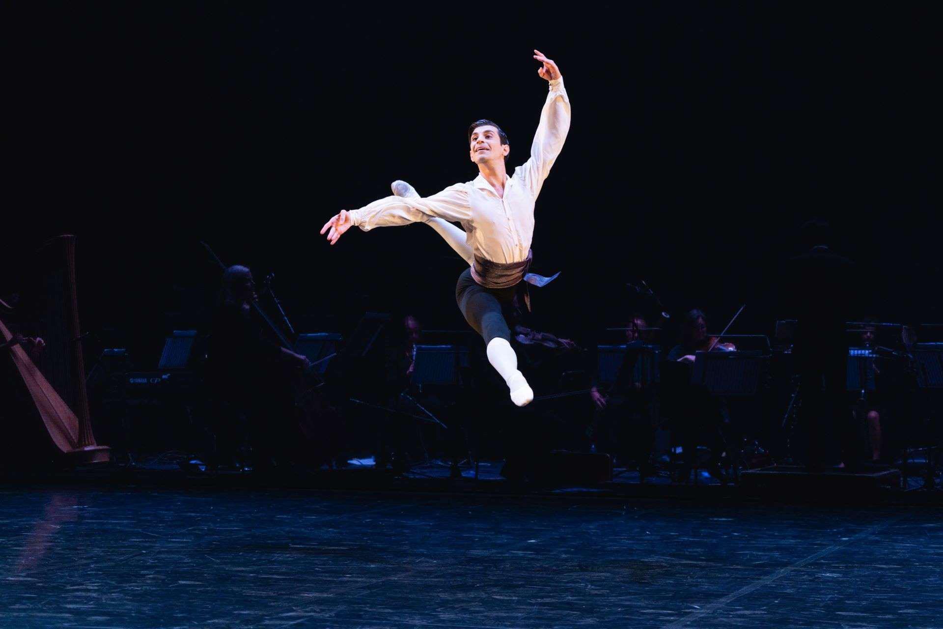 Dancer leaps across the stage