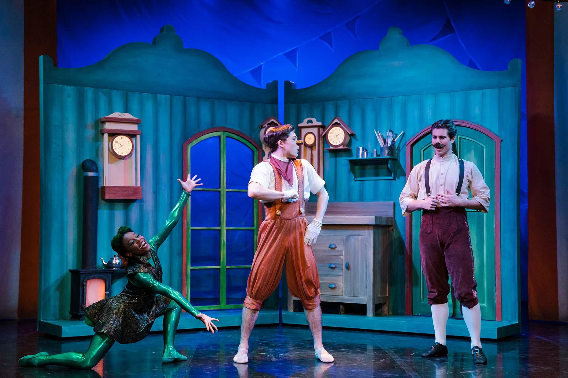 Pinocchio looks questioningly at the shocked Geppetto while the fairy presents him