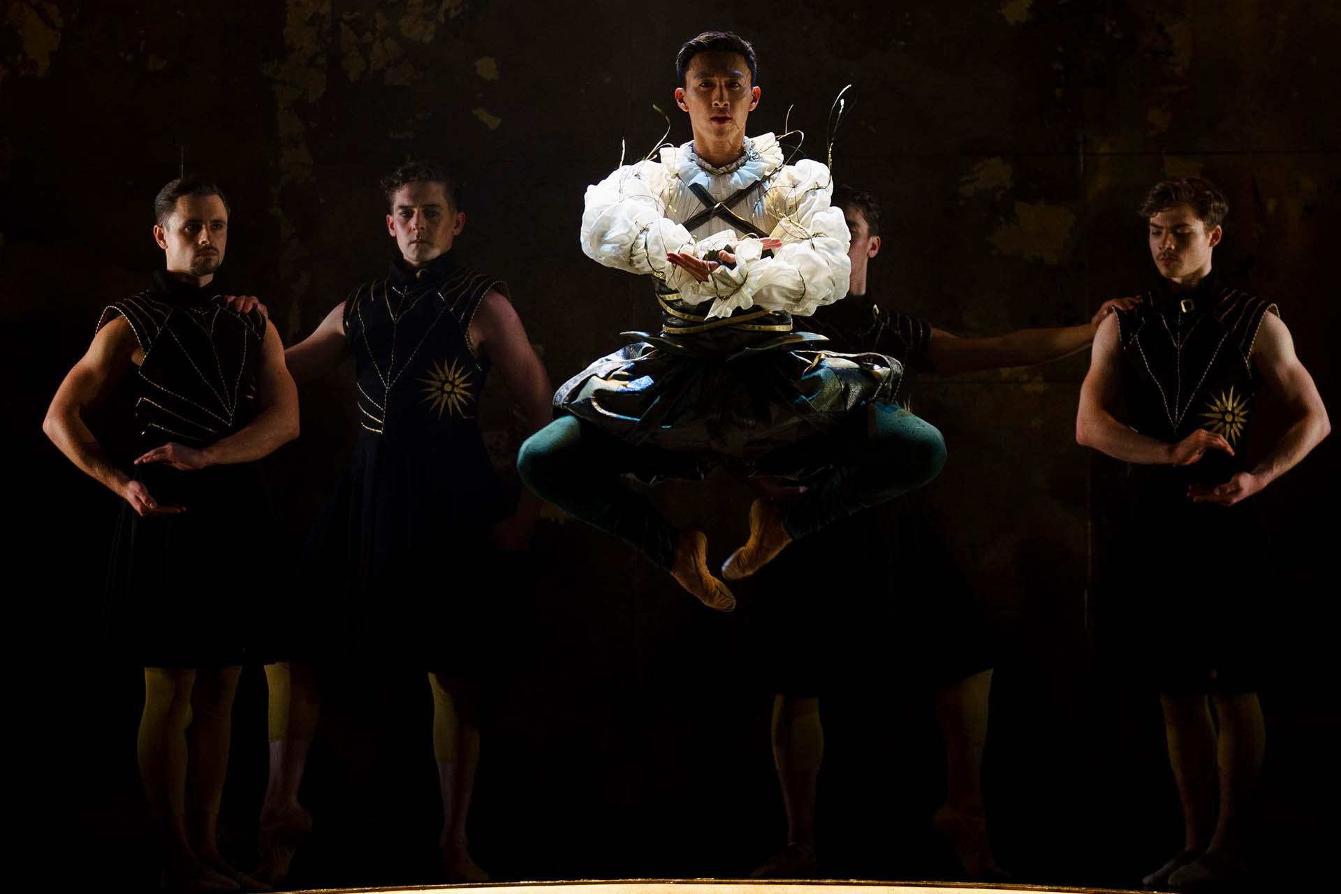 Merlin dressed for the royal court leaps on instruction