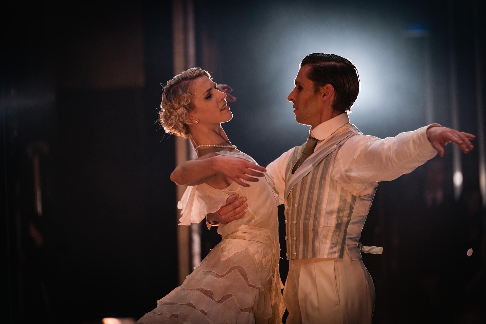 Daisy being held by Jay while they look into one another's eyes with love