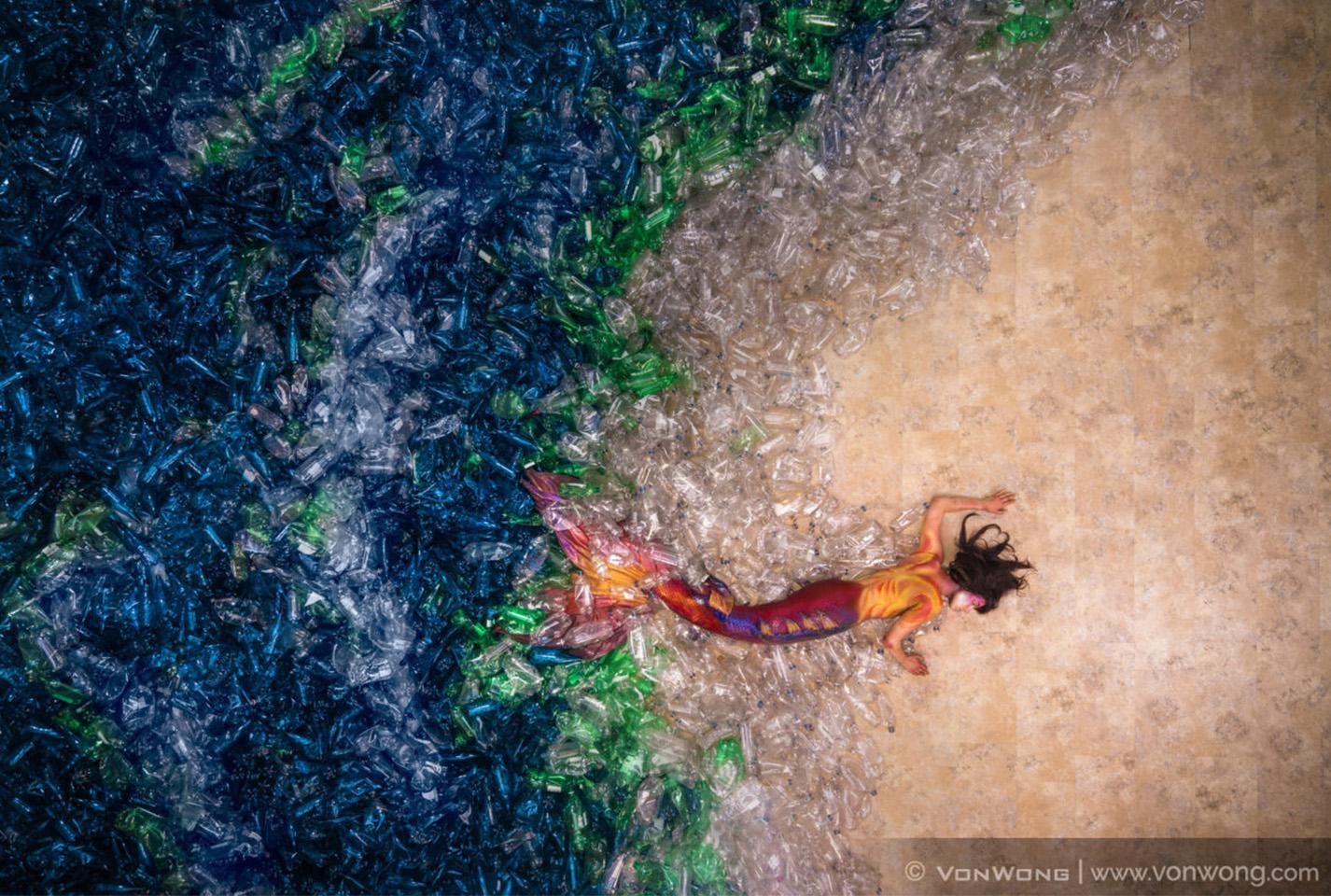 Image of a mermaid swimming out of water stylised from plastic bags