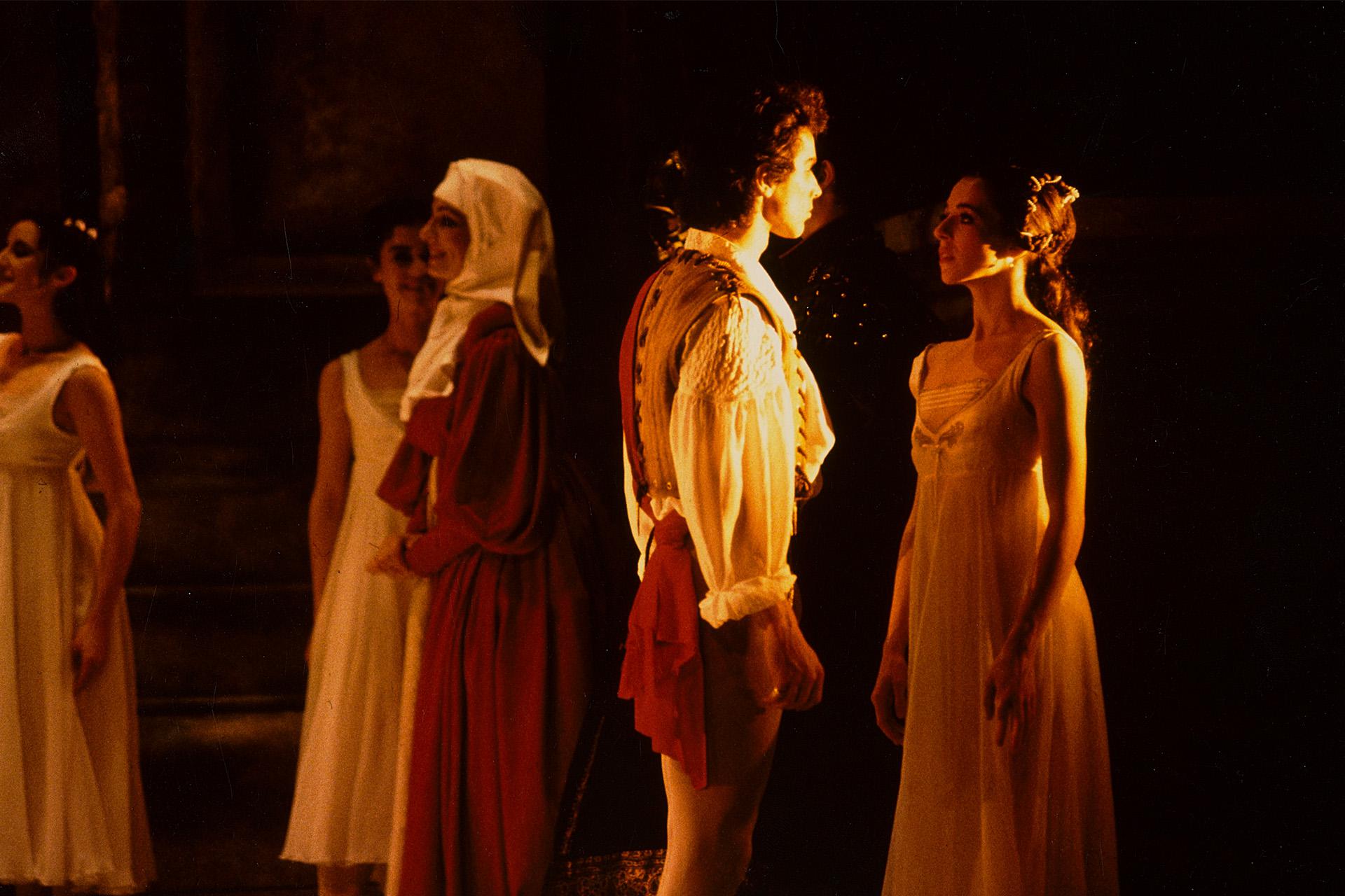 Two dancers gazing into each others eyes, performing in Romeo &amp; Juliet