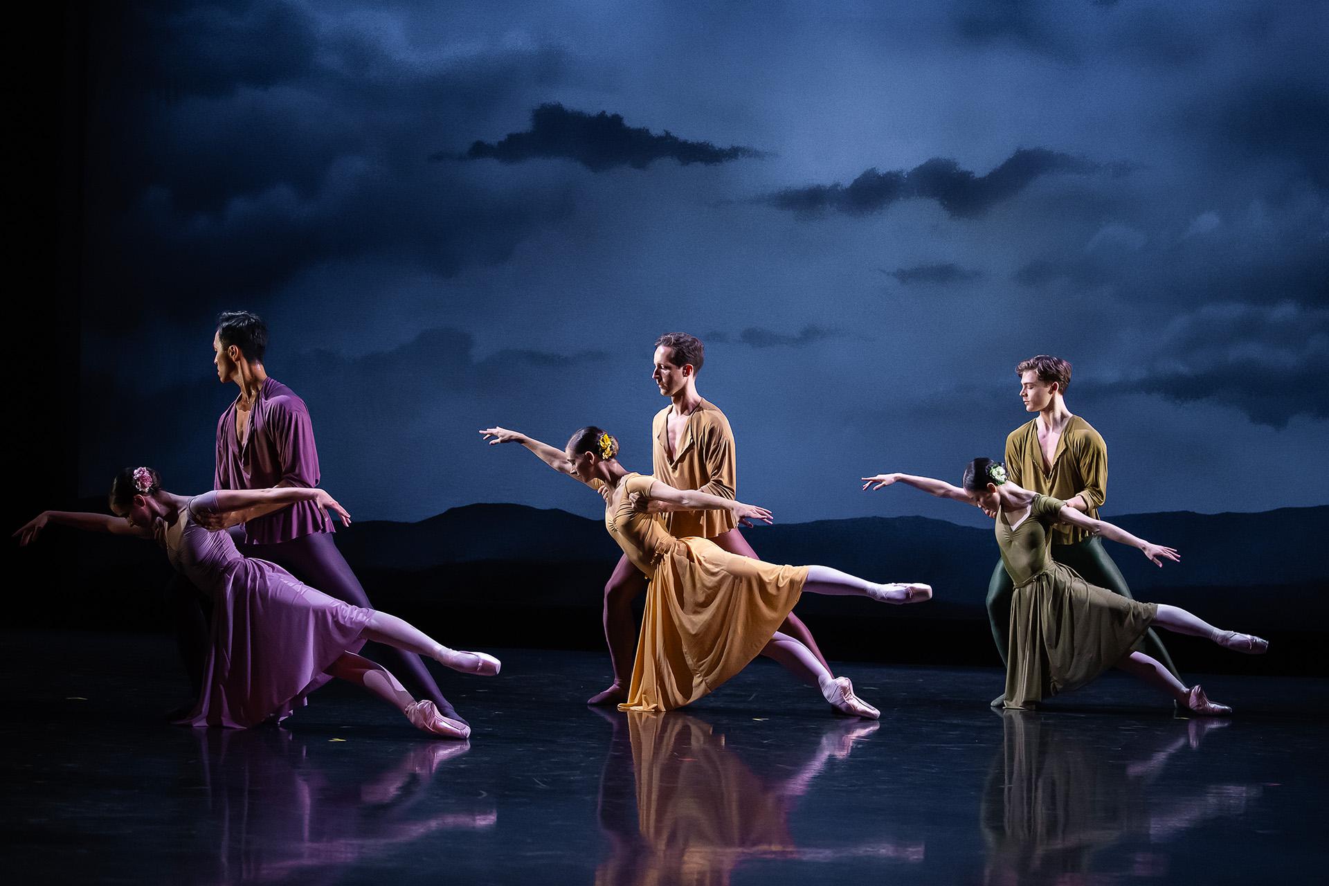 Three couple, one in lilac, one in yellow, one in green, strike identical poses where one partner stands straight holding the other as she hold one arm above her and both legs behind.