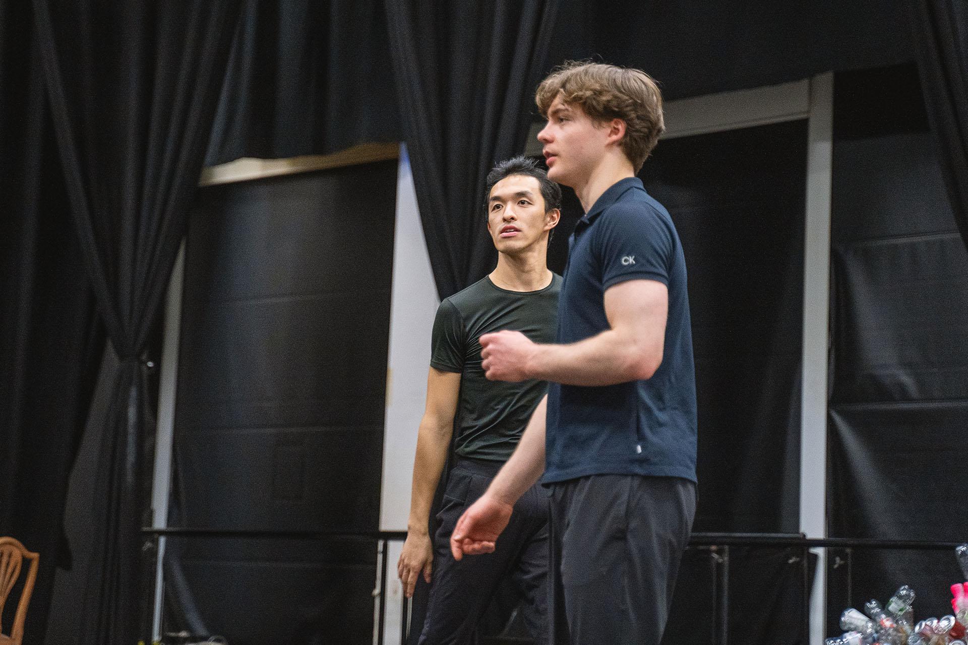 A low angle shot of the two choreographers of Hansel &amp; Gretel giving instruction in the rehearsal rookm