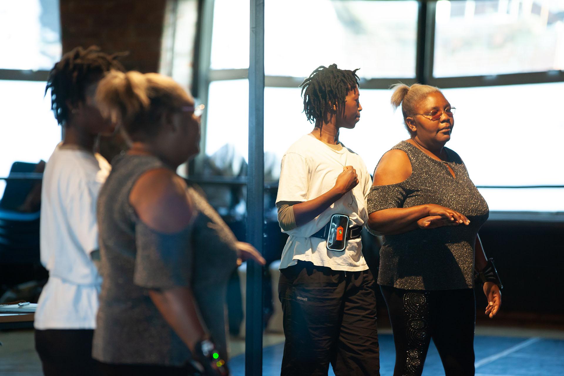 Reflection of two people in a mirror