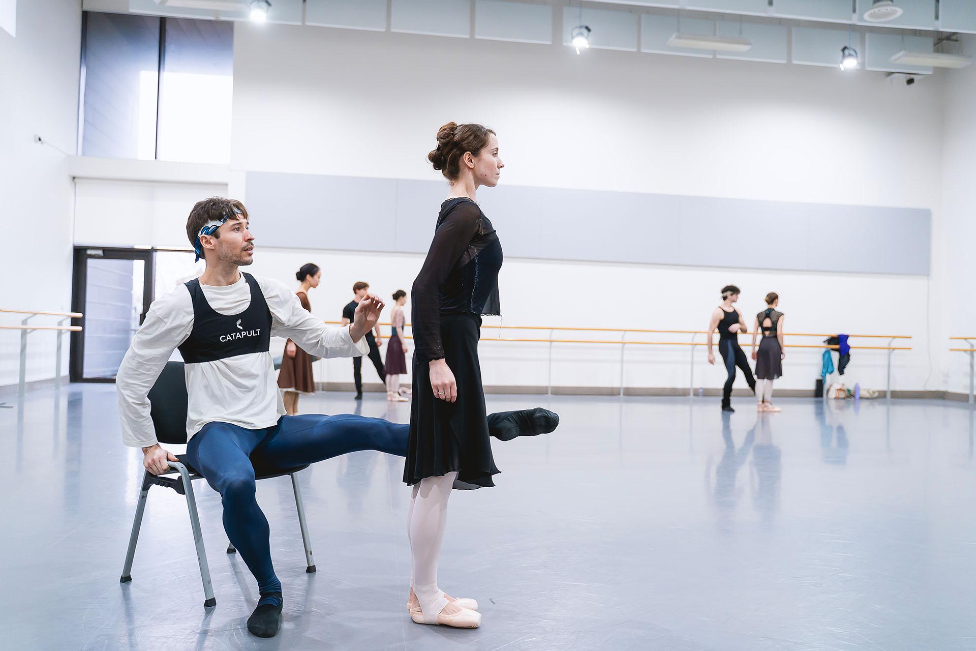 In rehearsals, he sits on a chair, his outstretched leg blocking her way, she stands pensively awaiting its removal