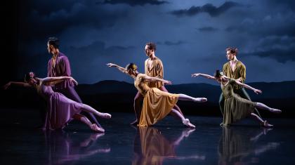 Three couple, one in lilac, one in yellow, one in green, strike identical poses where one partner stands straight holding the other as she hold one arm above her and both legs behind.