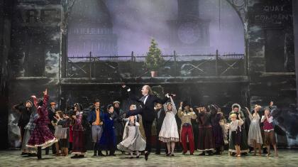 A dancer on stage jumping up in joy
