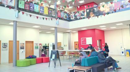 The Northern Ballet atrium with people sat