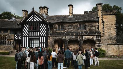 Northern Ballet dancers and Gentleman Jack creatives gathered outside Shibden Hall in Halifax learning about it and Anne Lister's history